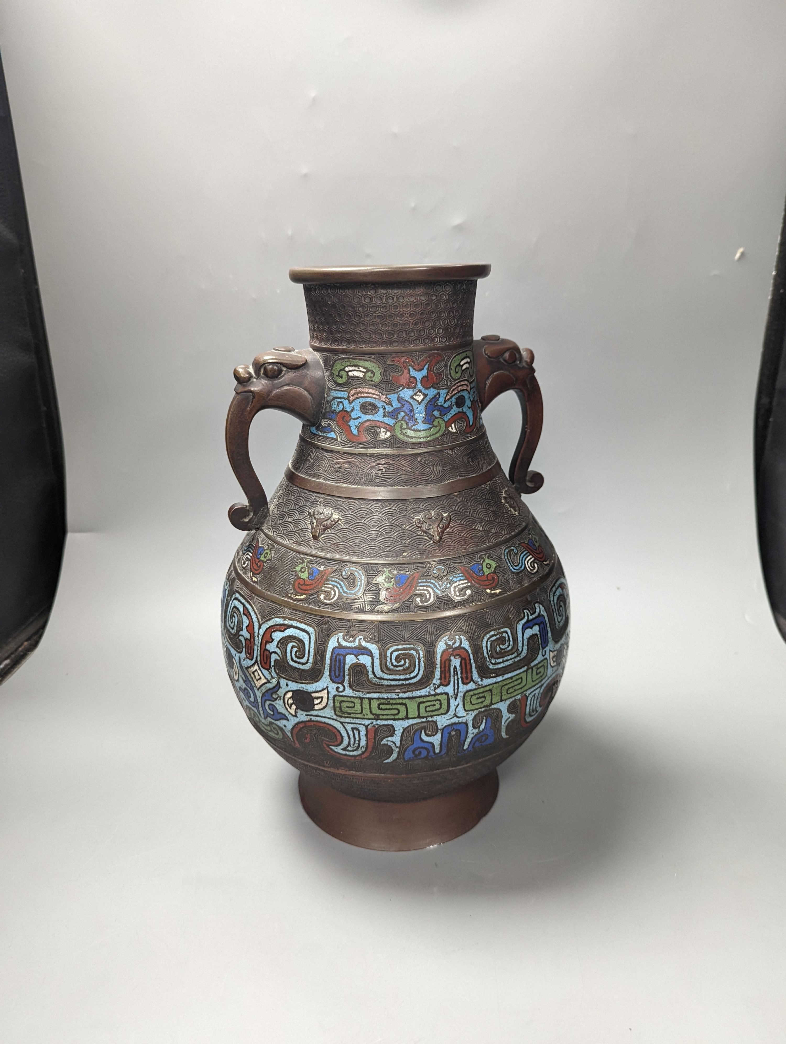 A large Japanese cloisonné enamel bowl on stand and a similar champleve enamel 2 handled vase, Cloisonné bowl and stand 36 cms high.